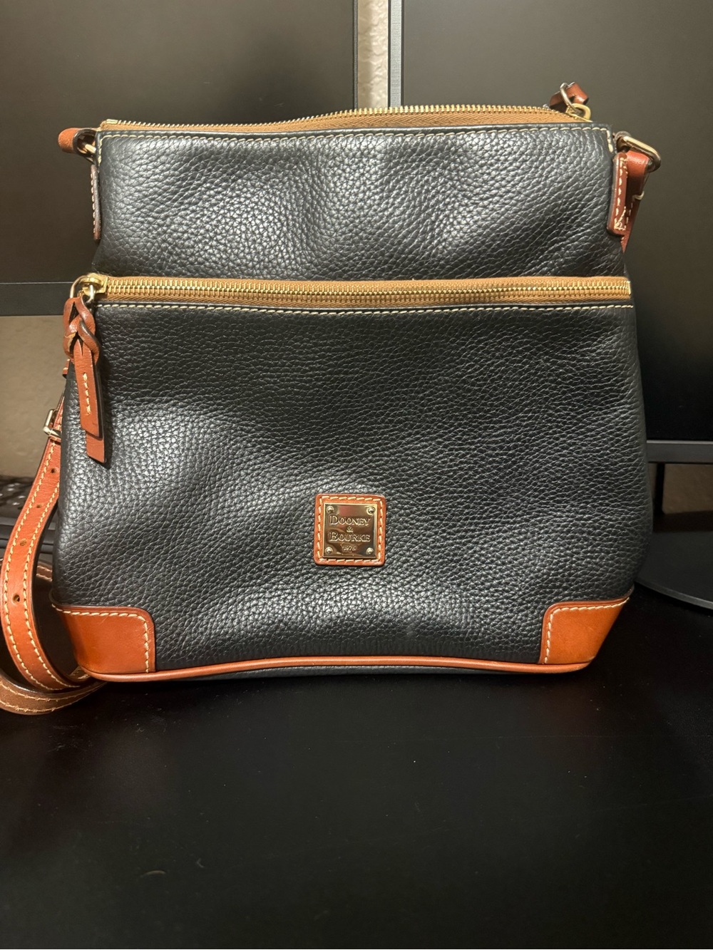 Dooney & Bourke Black Pebbled Leather Crossbody with Brown Trim